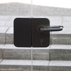 detail of door handles on glass door