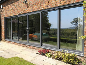 sliding doors in a residential property leading out onto a swimming pool